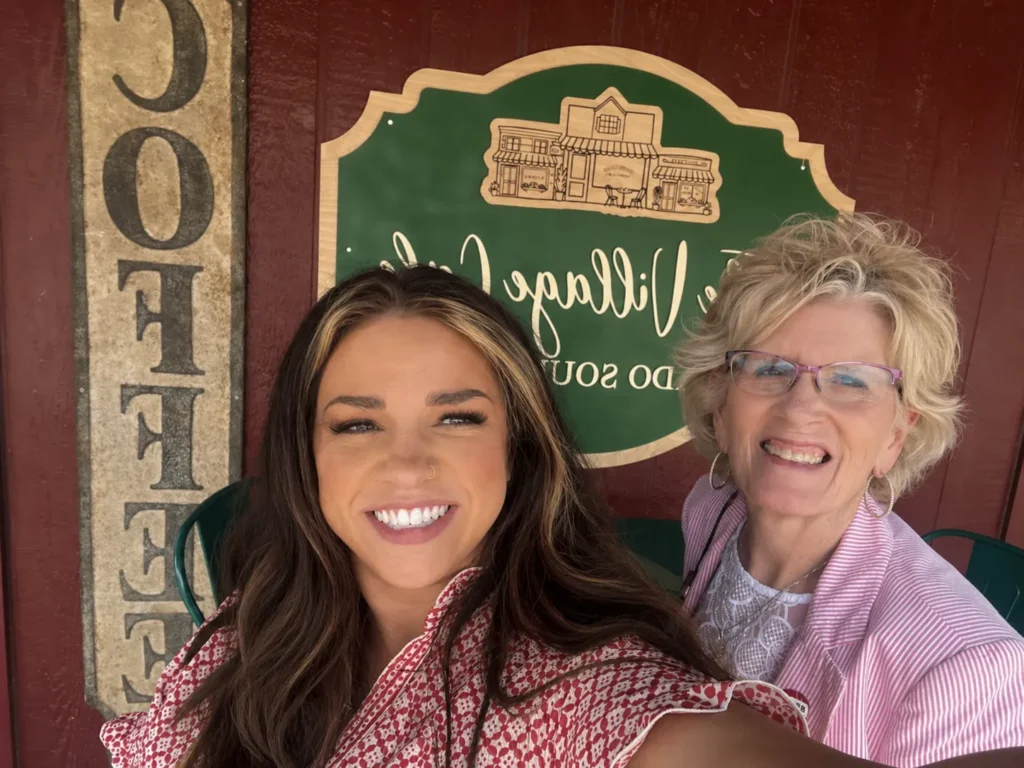 Shot of Mallory and Becky in front of The Village Cafe