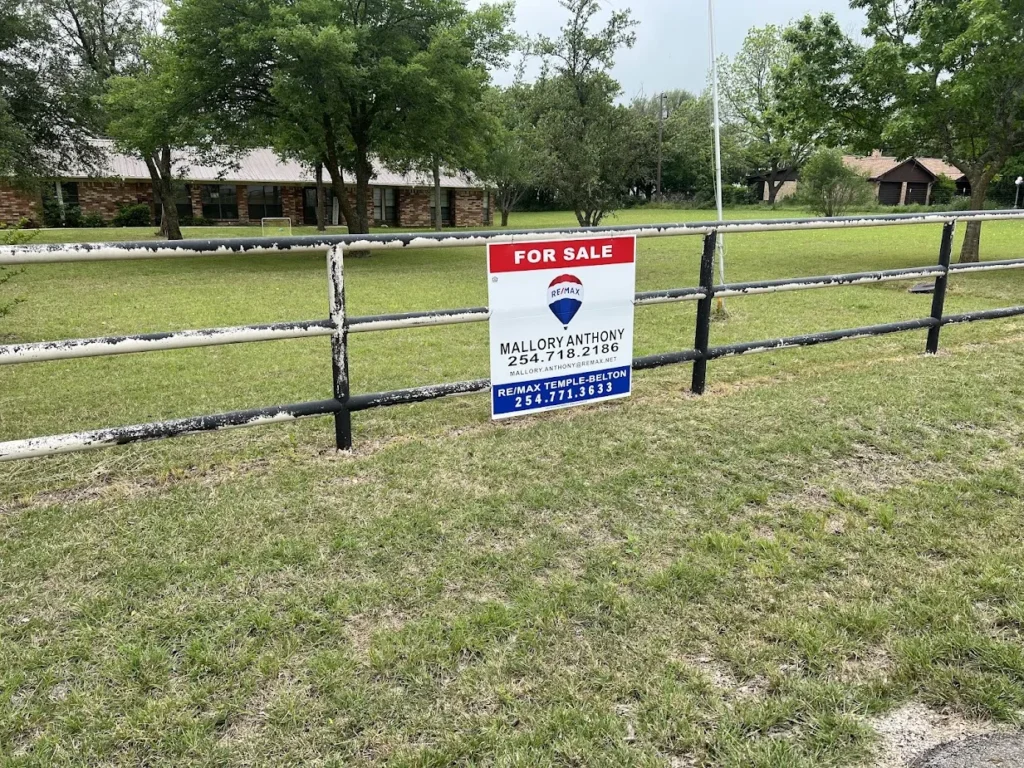 Top Mistakes Buyers Make When Purchasing Land in Texas (And How to Avoid Them) 3 for sale sign with mallorys information